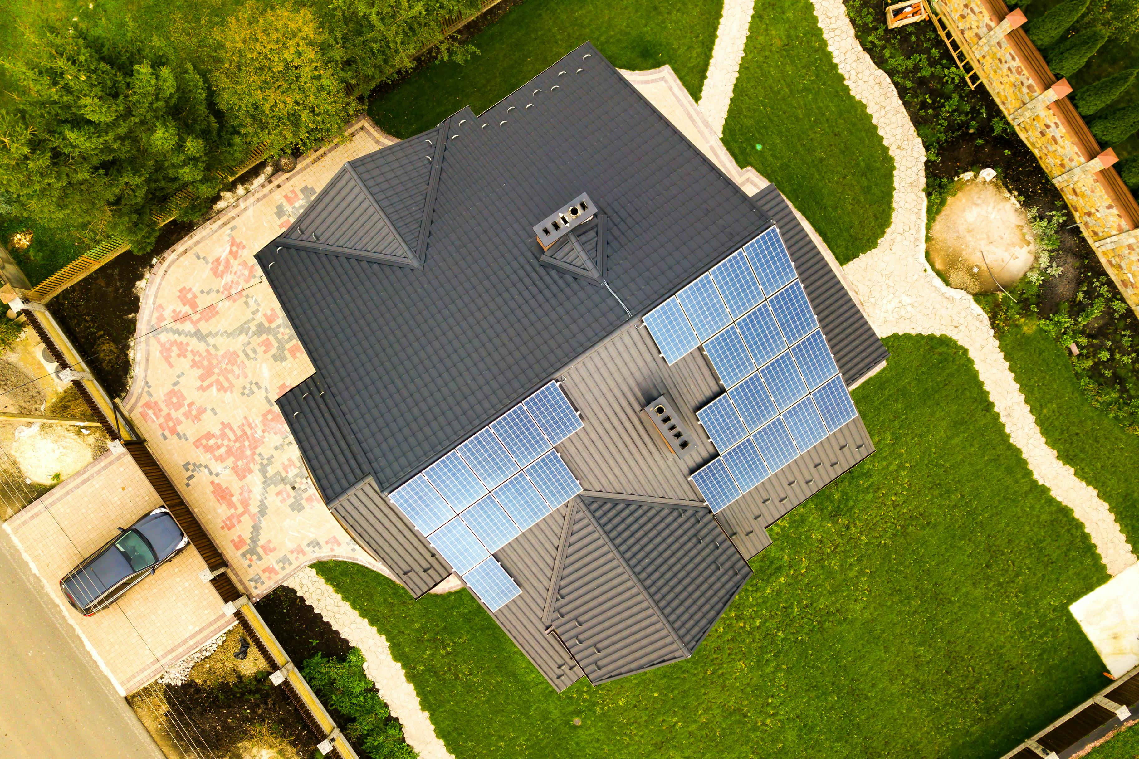 Aerial view of a house with solar panels